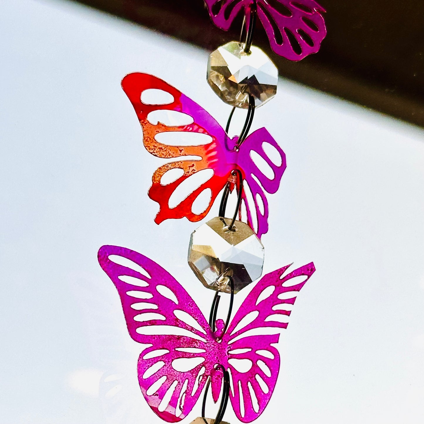 Broken butterfly strand suncatcher