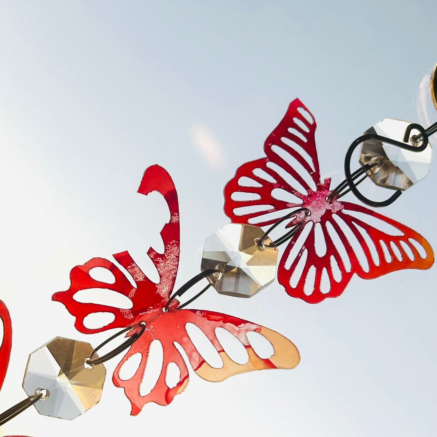 Broken butterfly strand suncatcher