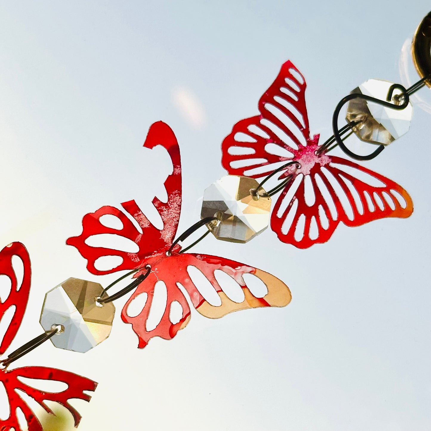 Broken butterfly strand suncatcher